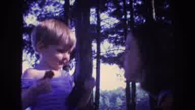 Baxter Maine USA (1975): Young Child In A Park Near The River With Its Parents