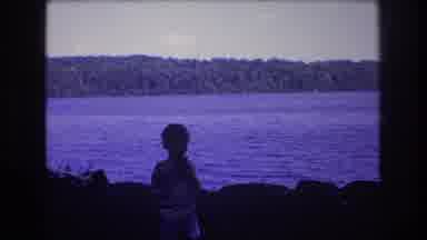 Baxter Maine USA (1975): Person Recording A Child Playing By Water