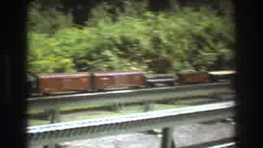 Baxter Maine USA (1975): Railroad Cars That Are Not Moving On An Elevated Track
