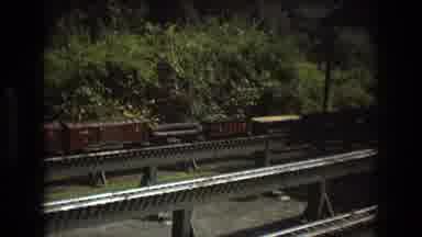 Baxter Maine USA (1975): A Man Works On A Toy Train At A Miniature Train Station