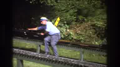 Baxter Maine USA (1975): Man Riding A Model Train