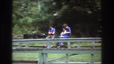 Baxter Maine USA (1975): People Sitting On A Toy Train That Takes Them By The