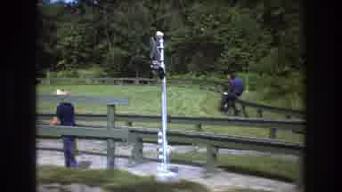 Baxter Maine USA (1975): Two People Riding On A Rail That Is Connected To A Train