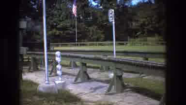 Baxter Maine USA (1975): Two Men And A Boy Riding On A Small Train On Raised Train