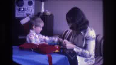 Baxter Maine USA (1975): Mother And Child On Christmas Day Setting Up A Toy That