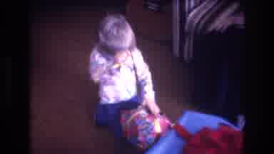 Baxter Maine USA (1975): A Lil Boy Opening Up His Gift That His Mother Gave Him
