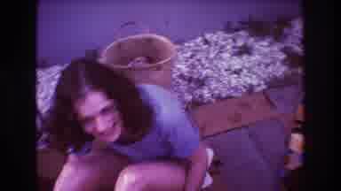 Boston USA (1975): Young Woman With Curly Hair Sitting Outside And Laughing