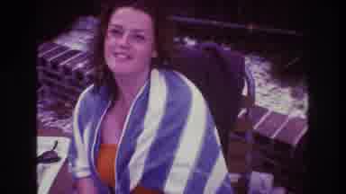 Boston USA (1975): A Woman Wrapped In A Blue And White Towel Stares At The Camera