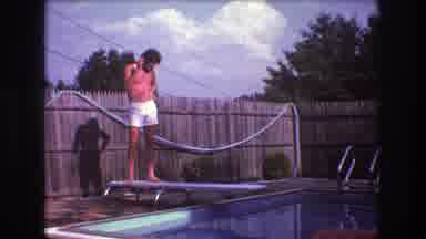 Boston USA (1975): Man Riding Trike Into Pool