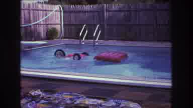 Boston USA (1975): Man In Pool With Tricycle