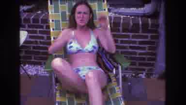 Boston USA (1975): A Woman Lounging In Lawn Chair At A Gathering Of Friends