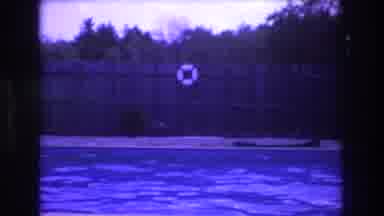 Boston USA (1975): Panning A Pool Inside A Backyard With Toys And Fence