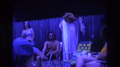 Boston USA (1975): Group Of Men And Women Gathered In The Yard Outside