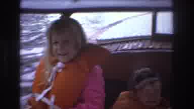 Boston USA (1975): Two Small Children On A Boat Wave To The Camera While Their
