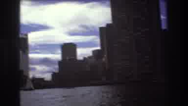 Boston USA (1975): Toddler Boy In Rocking Boat Wearing Life Vest Near City