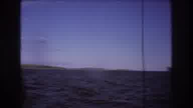 Boston USA (1975): Observing Large Ship On Deep Blue Sea Traveling Near Land