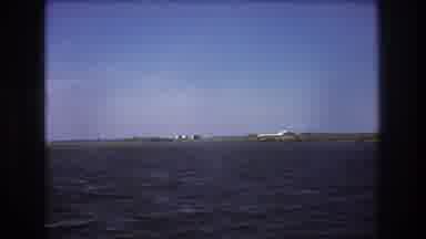 Boston USA (1975): Aeroplane Trying To Take Off While Camera Focuses On Both Water