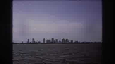 Boston USA (1975): View Of A Airplane And Boat Along The Coastline Of A Large City