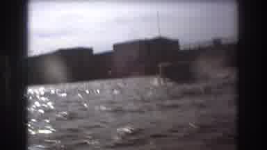 Boston USA (1975): Boats Passing Another Boat On The Lake Or Ocean Next To A City