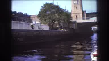 Boston USA (1975): Men Fishing On A Docked Boat In The Bank Under A Bridge