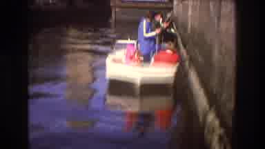 Boston USA (1975): Man Pouring Fuel From One Container Into Another In A Boat