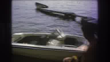 Boston USA (1975): A Man Stands At The Docks Looking At His Small Motor Boat In