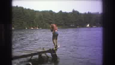 Boston USA (1975): Person Standing At The Edge Of A Wooden Dock Over The Water