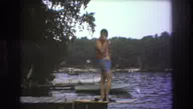 Boston USA (1975): Man Posing For And Talking To The Camera Is On The Edge Of A