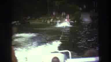 Boston USA (1975): Dark Haired Man In A Boat Giving Water Rides To People From The