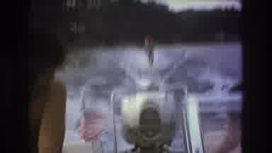 Boston USA (1975): Point Of View Speed Boat Pulling A Skier Behind Them On A Lake
