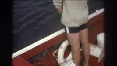 Boston USA (1975): Man Stands By The Edge Of A Boat And Looks Out Into The