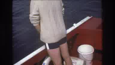 Boston USA (1975): The Man Is Peeing Overboard While Woman Looks On