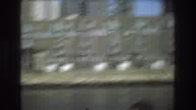 Boston USA (1975): A Brick Building That Sits Next To A Small Patch Of Trees By