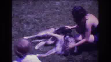 Mt Bromley Vermont USA (1976): Woman Child Dog Laying Down Grass Puppy Romp Away