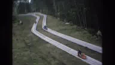 Mt Bromley Vermont USA (1976): Kids Racing Down A Slide In Tubes Cheering With