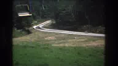MT Bromley Vermont USA-1976: Sky Lift With A View Of A Track By Forest