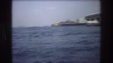 New York City USA (1976): Woman In A Boat On The Coast Looking At The Shore Or