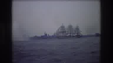 New York City USA (1976): An Old Wooden Masted Ship Sailing Out To A Calm Sea