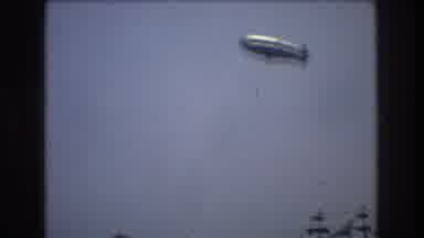 New York City USA (1976): Boats Sailing The Seas And Zeppelin Furrowing The Sky