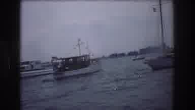 New York City USA (1976): Various Boats And Americans Sail Near A Busy Port On A