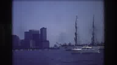 New York City USA (1976): Boat Enters Harbor In Front Of Buildings Alongside