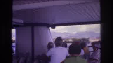 Honolulu Hawaii a USA (1977): A Group Of People Are Sitting On A Ferry Taking In