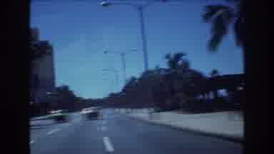 Honolulu Hawaii a USA (1977): Driving In Traffic On Road Along Hotels And Palm