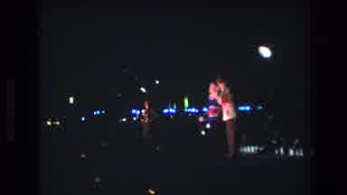 Honolulu Oahu Hawaii USA (1977): Two People Standing Next To Each Other At Night