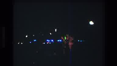 HONOLULU OAHU HAWAII USA-1977: People At Nighttime Festival With Blue Lights