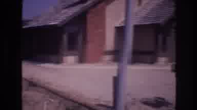 Las Vegas USA (1977): Brown Home With Brick Chimney Located In A Desert Area