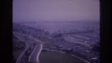 Las Vegas USA (1977): An Empty Highway That Leads To A Parking Lot Full Of Cars
