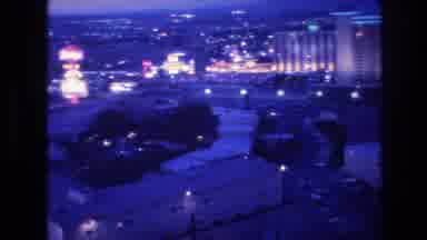 Las Vegas USA (1977): High-Rise Buildings And Parking Lots And Lights Fill An