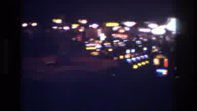 Las Vegas USA (1977): Large Lights Above Yellow Blue People Walking Standing Many