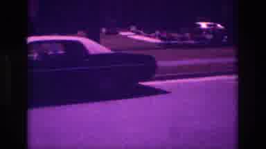 San Diego B USA-1981: Classic Car Driving On Suburban Street At Night